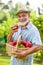 Gardener holds a basket of ripe apples