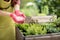 Gardener holds in hands mineral fertilizing, close-up