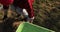 Gardener man hand hold drives wheelbarrow with dry grass pov point view