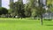 Gardener moving the lawn at Parque das Nacoes in Lisbon, Portugal