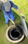 Gardener obove underground rainwater cistern