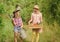 Gardener occupation. Taking care of plants. Cute gardener concept. Loving nature. Sisters helping at backyard. Girls