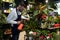 a gardener in a plant nursery tending flowers