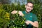 Gardener pruning a tree or plant at nursery