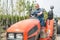 Gardener rides on the tractor at garden store