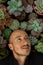gardener\\\'s face surrounded by succulent plants