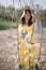 Gardener woman checking blossomed trees in garden