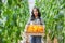 gardener woman harvests bell peppers in garden