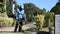 Gardener working and gardening use machine cutting grass at garden park