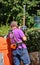 Gardener works with a hedge trimmer