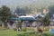 Gardeners cutting grass in a beautiful park in Pahalgam