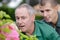 Gardeners talking while gardening at plant nursery