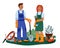 Gardeners with tools. Couple take care of plants. Man and woman in work clothes on garden plot with gardening