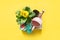 Gardening background with gerbera, tolls and flowers plant in box on yellow background. Top view