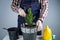 Gardening concept. Transplanting and seeding new plants fir-tree. Closeup on hands and pots. Man gardener transplants houseplant