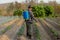 Gardening concept a young male farmer spraying a chemical pesticide for preventing the crops from the pests