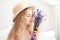 Gardening and people concept happy young woman smelling lavender flowers. Cute little Girl holds a bouquet of lavender. Lifestyle