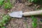 Gardening shovel in an orchard during the gardener`s rest