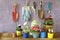 Gardening in the springtime, young crocus, pansy, primula and buttercup flowers with gardening tools,copy space