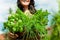 Gardening in summer - woman with herbs