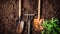 Gardening tools on fertile soil texture background seen from above, top view. Gardening or planting concept. Working in the spring