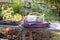 Gardening tools sit on a potting bench