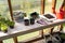 Gardening tools on a table prepared for planting new seedlings in a greenhouse. Hobbies and relaxation concept