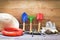 Gardening tools on wooden background with pliers straw hat , rope , gloves trowel garden equipment