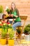 Gardening woman plant spring flower terrace