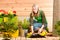 Gardening woman plant spring flower terrace