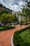 Gardens along a brick path in Boston, Massachusetts.