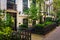 Gardens and townhouses along 23rd Street in Chelsea, Manhattan,