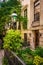 Gardens and townhouses along 23rd Street in Chelsea, Manhattan,