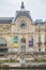 Gare Orsay or Orsay museum building facade and Seine river dock in a cloudy day in Paris