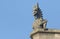 A Gargoyle against a blue sky.