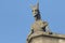 A Gargoyle against a blue sky.