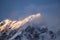 Garhwal Himalayas snow peaks in the blue sky covered by the floating fog clouds in India