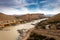 Gariep Damn wall, with water flowing through the dam gates into the river