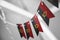 A garland of Angola national flags on an abstract blurred background