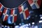 A garland of Dominicana national flags on an abstract blurred background