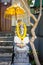 Garland of golden flowers draped around Ganesha