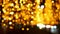 A garland with golden lights hanging in the park in the evening, a blurry image.