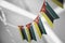 A garland of Mozambique national flags on an abstract blurred background