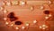 A garland of stars and cedar cones on a wooden surface