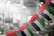A garland of United Arab Emirates national flags on an abstract blurred background