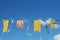 Garland of yellow flags on background blue sky
