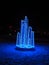 Garlands with glowing blue light. Iceberg or ice crystals as decoration. Street decor for New Year or Christmas. Blue bokeh lights