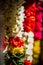 Garlands of red and yellow flowers. Flower stall selling garlands for temple and marriage functions. Selling flowers Garlands on