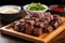 garlic bbq steak tips with dipping sauce on the side