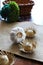 Garlic bulbs and straw hats on the jute fabric with wicker basket and dried flowers